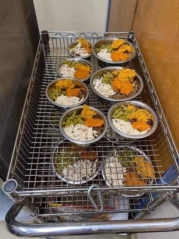 a metal basket filled with lots of food