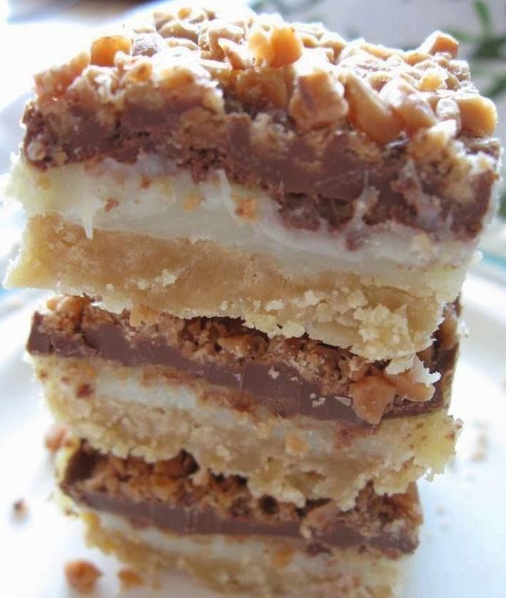 three pieces of cake sitting on top of a white plate