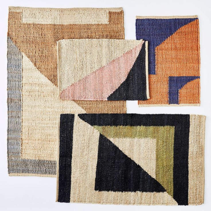 four rugs with different shapes and colors