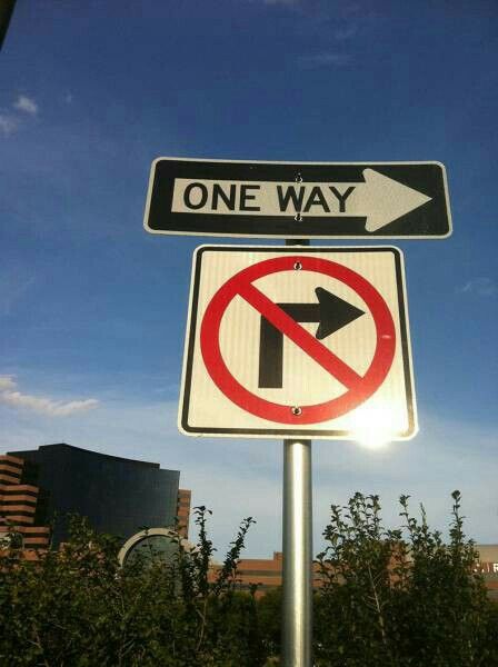 one way and no left turn street signs