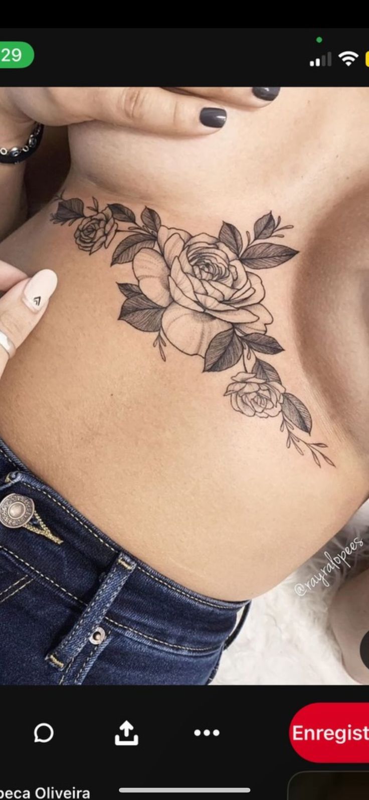 a woman with a rose tattoo on her stomach