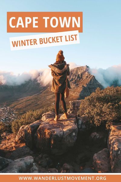 a woman standing on top of a mountain with the words cape town winter bucket list