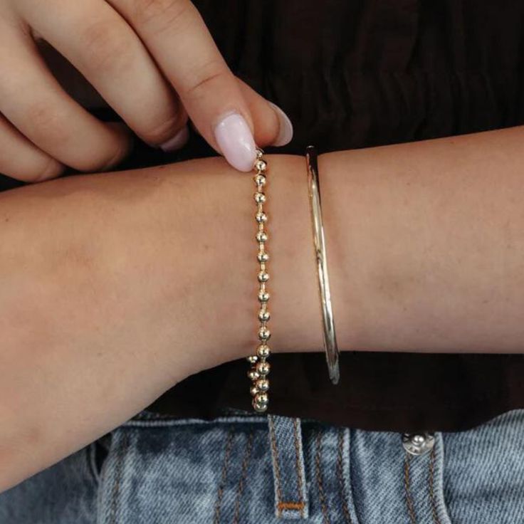 Level up your accessory game with the timeless look of this high polished 14K yellow gold Bead It Collection bracelet. It's a standout addition to your collection, perfect for wearing solo or mixing and matching with your current favorites! Wear with our matching earrings, necklace, and ring. 14K Yellow Gold Width: 4mm Length: 7 Inches Lobster Clasp Elegant 14k Gold Bracelet With Gold Beads, Minimalist Beaded Bracelets With Ball Chain, 14k Gold Jewelry With Round Beads, Elegant Stackable Beaded Bracelets In 14k Gold, Classic Yellow Gold Jewelry With Gold Beads, Elegant 14k Gold Jewelry With Gold Beads, Elegant Stackable 14k Gold Beaded Bracelets, Elegant Gold Beaded Bracelets With Ball Chain, Elegant Everyday Ball Chain Bracelets