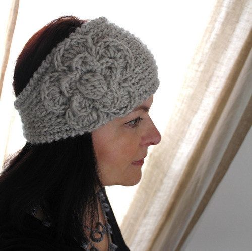 a woman wearing a gray crochet headband next to a window with curtains