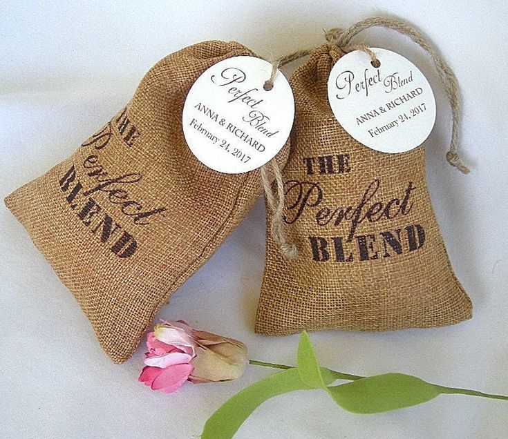 two burlap bags with the words perfect blend on them next to a flower