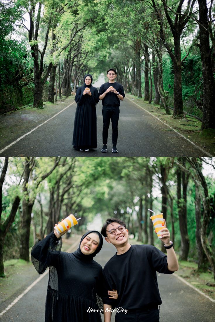 two people standing in the middle of a road with trees on both sides and one person holding