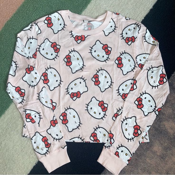 New Without Tags Sanrio Hello Kitty All Over Print Graphic Long Sleeve Tee. 100% Cotton. B-18” L-20” Cheap Hello Kitty Print Sleepwear For Summer, Sanrio Outfits, Hello Kitty Print, Kitty Clothes, Hello Kitty Clothes, Comfy Pjs, Kitty Accessories, Hello Kitty Accessories, Hello Kitty Pink