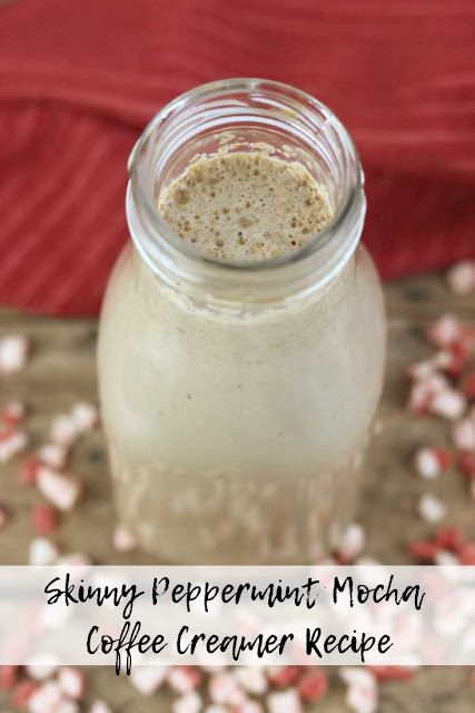 a glass jar filled with coffee creamer next to red and white sprinkles