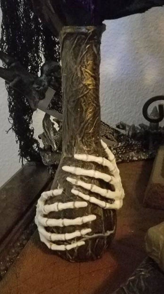 a vase that has been made to look like a skeleton