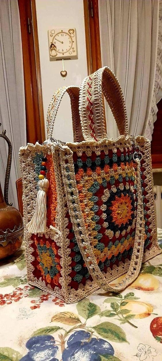 a crocheted bag sitting on top of a table