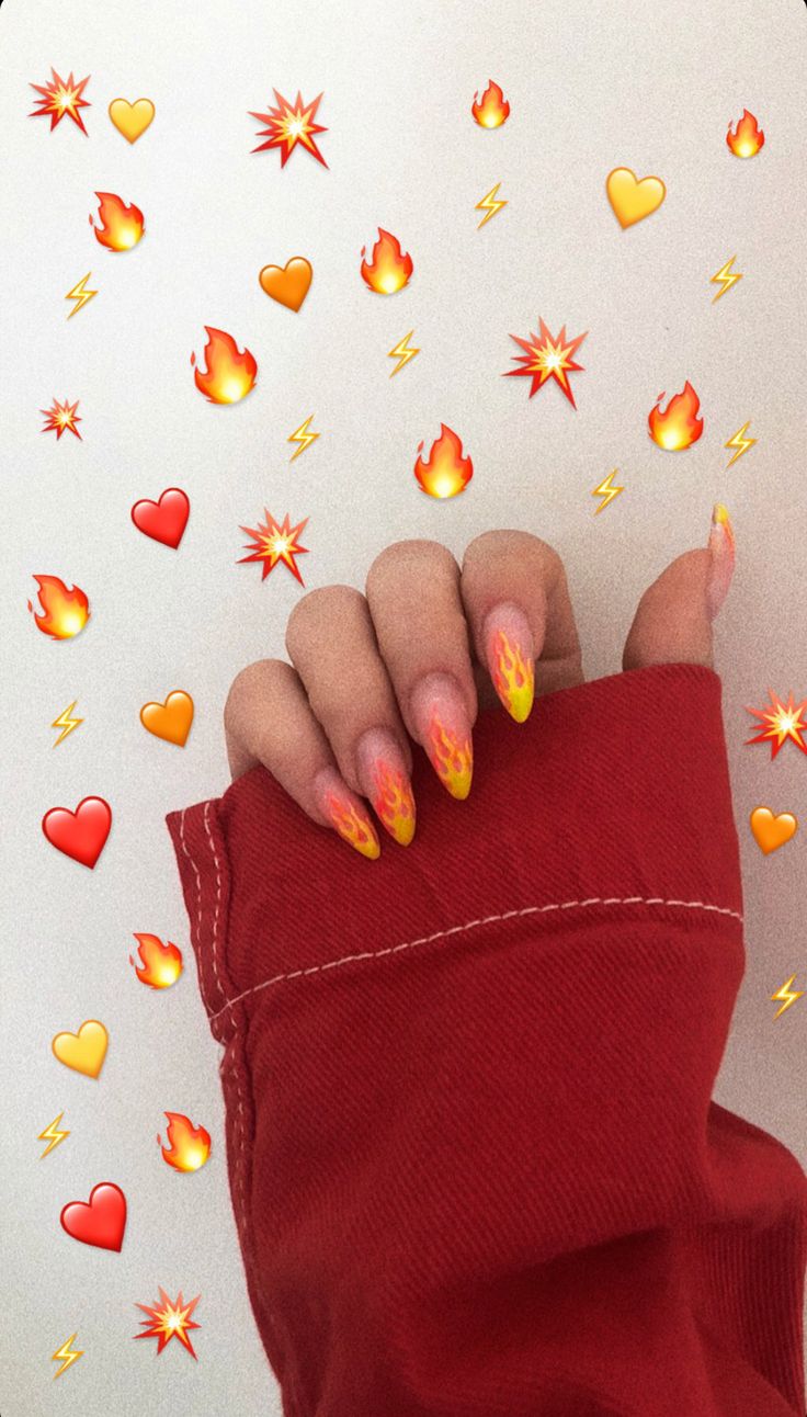 a woman's hand with yellow and red nail polish on it, surrounded by hearts