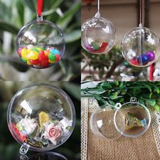 there are four different glass ornaments hanging from the ceiling and one is filled with candies