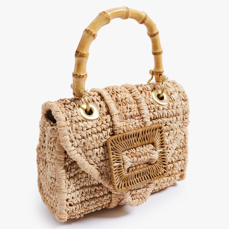 Timeless and posh, Pamela Munson’s straw accessories are beloved by island hoppers and city dwellers alike. Her bags reinterpret straw as a natural, sustainable material that can be worn any season, anywhere. Finally, a gold minaudière that goes with everything. This handwoven raffia handbag is expertly crafted and beautifully finished with brushed gold mini hardware, bamboo and rattan. Every detail is considered with special attention to function and versatility. Named after Pamela’s grandmothe Beige Straw Bag With Bamboo Handle, Gold Woven Top Handle Straw Bag, Handwoven Rectangular Gold Straw Bag, Natural Straw Bag With Detachable Handle For Travel, Handwoven Gold Rectangular Straw Bag, Chic Natural Fiber Shoulder Bag With Bamboo Handle, Natural Color Straw Bag With Detachable Top Handle, Natural Straw Bag With Detachable Top Handle, Handwoven Gold Straw Bag For Vacation