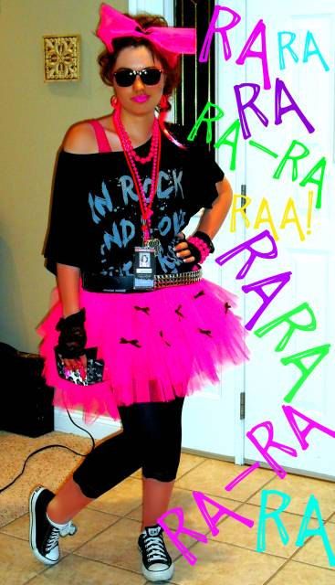 a woman in a pink tutu skirt and black shirt