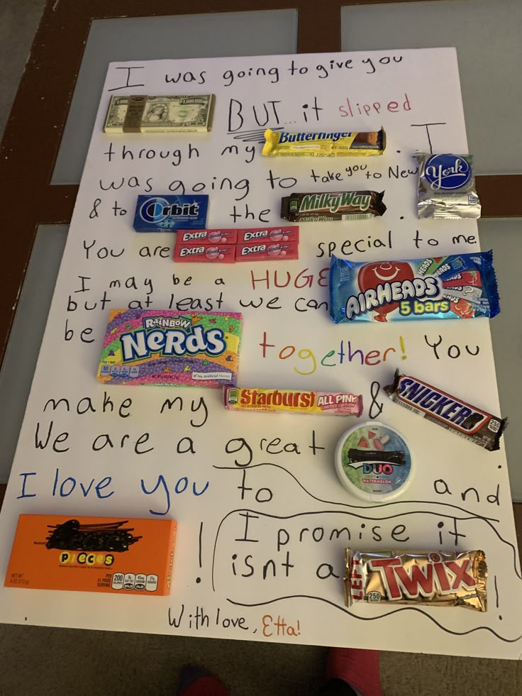 a white board with candy and writing on it