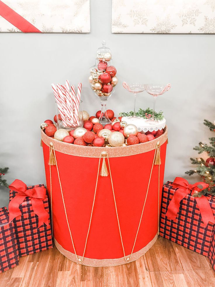 a large red basket filled with christmas decorations