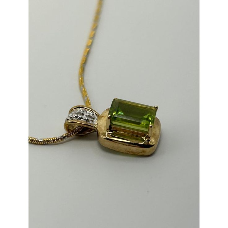 This is part of Chairish’s Fine Jewelry assortment.  14k Yellow Gold & Peridot Pendant & Necklace. Weight: 5 grams Weight of Chain: 3.2 grams Weight of Pendant: 1.8 grams  Chain Lth: 16 in.  Peridot: approx. 8.09 mm x 6.27 mm Gift Yellow Gold Peridot Gemstones, Formal Peridot Jewelry For May Birthstone, Fine Jewelry Hallmarked Peridot, Gold Peridot Jewelry With Gemstone Accents, Peridot Jewelry With Gemstone Accents In Gold, Gold Peridot Necklace For Formal Occasions, Fine Jewelry Peridot For Formal Occasion, Gold Necklace With Peridot For Formal Occasions, Formal Peridot Gemstones For May Birthstone