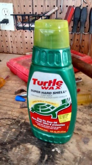 a bottle of turtle super hard shell insect repellent sitting on top of a table