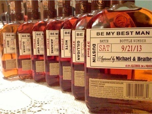 several bottles of whiskey are lined up on a table