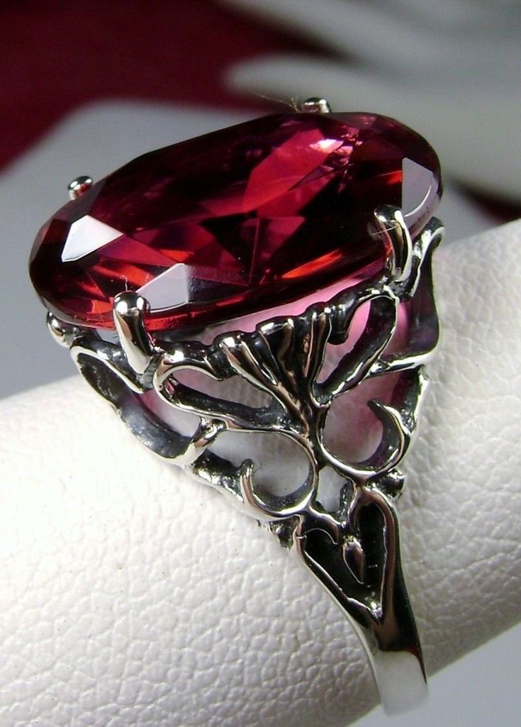 Simulated Red Ruby Ring OK Design #10 Custom Made This is a brand new stunning Art Nouveau/Vintage designed sterling silver 925 filigree 8 carat simulated red ruby ring. The Flawless oval full cut high-quality gemstone is 16mm x12mm. This lovely gemstone sits 8mm off the finger. The inside of the band is marked 925 for sterling silver. Notice the beautiful filigree swirl like the craftsmanship of the silver setting. This lovely ring stands out and illuminates the finger with its great shine. The Vintage Oval Ruby Filigree Ring, Red Ruby Ring, Star Ruby Ring, Rubin Ring, Bakelite Jewelry, Vintage Revival, Edwardian Jewelry, Rug Patterns, Gold Rings Fashion