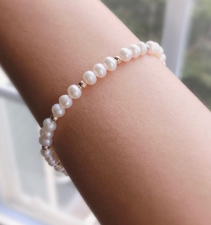 "* DETAILS * - Freshwater Pearl Potato Shape White Pearls Size Approx.5mm - 14k Gold Filled Beads 3mm - All components are 14k Gold Filled  👉🏻 Fits wrist size from 6\" to 7.5\"  * CARE TIPS * - Perfumes: Be sure any perfume or lotions are completely absorbed into skin. - Hair products: Apply all hair products before putting on jewelry. - Swimming: Remove all jewelry before swimming or getting into hot tubes. - No sunlight: Store away from heat, direct sunlight, window sills and vents. - Bedtim Gold Single Strand Bracelet As A Gift, Classic Round Beads Bracelet For Anniversary, White Beaded Jubilee Bracelet For Anniversary, Single Strand Pearl Bracelet For Anniversary, Gold Bracelet With Pearl Charm And Round Beads, Dainty White Bracelets For Anniversary, Dainty White Bracelet For Anniversary, Single Strand Pearl Bracelets For Anniversary, White 8mm Beads Jewelry For Anniversary