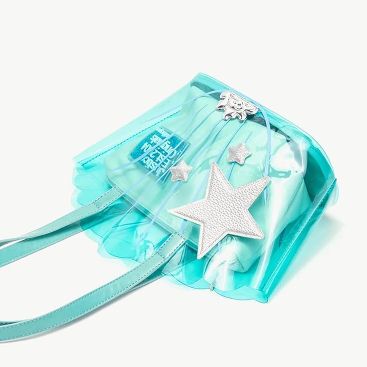 Elevate your mermaid-inspired look with our Transparent Shell Handbag. Free shipping in the US and worldwide. Length: 34 cm (13.39 inches); Height: 24 cm (9.45 inches); Width: 12 cm (4.72 inches). Crafted from high-quality PVC transparent material, this handbag is a whimsical addition to any outfit. Its unique shell shape and translucent design capture the essence of the ocean, making it perfect for mermaidcore enthusiasts. High-quality PVC transparent material ensures durability and water resistance, keeping your belongings safe and dry in style. The shell shape adds a playful and enchanting touch to your ensemble, making you feel like you've just emerged from the depths of the sea. Available in blue and pink colors, this handbag allows you to express your individuality and match your loo Mermaidcore Aesthetic, Blue Shell, Mermaid Inspired, Transparent Bag, Platform Mary Janes, Transparent Material, Boots And Sneakers, Blue And Pink, Stay Organized