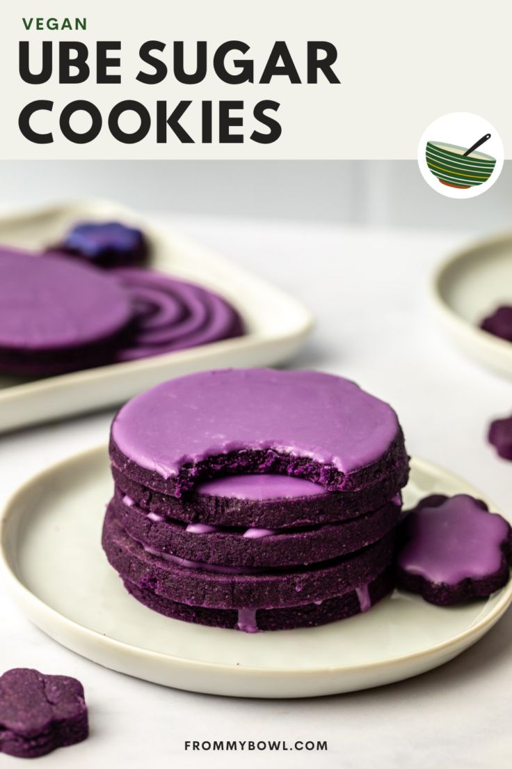 vegan ube sugar cookies with purple icing on white plates and text overlay