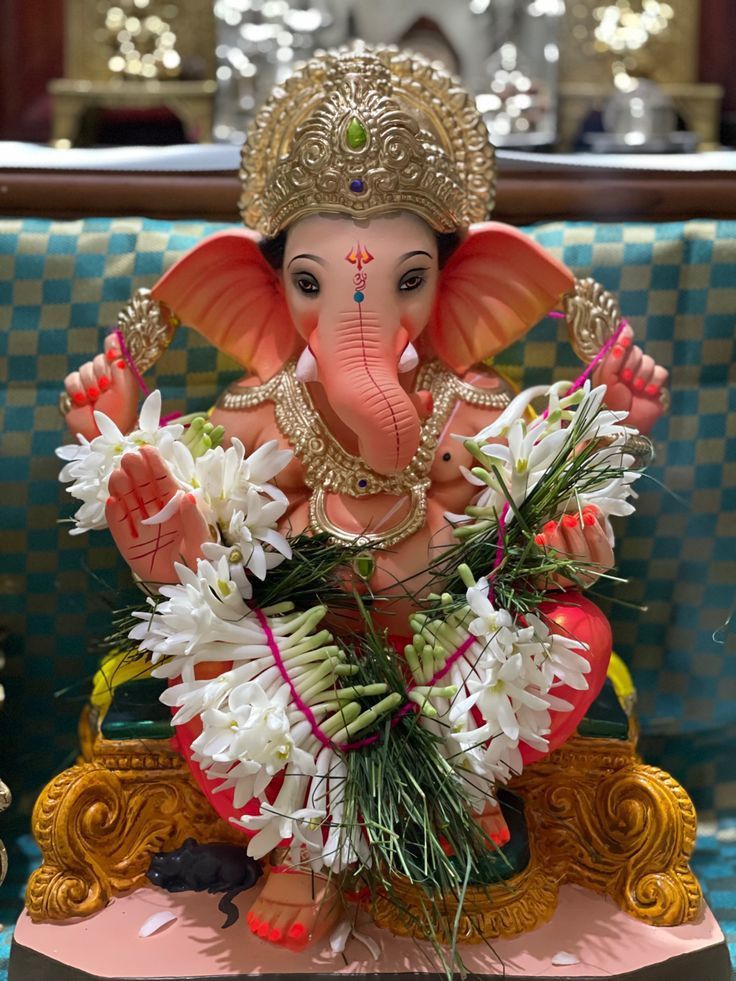 an elephant statue sitting on top of a table