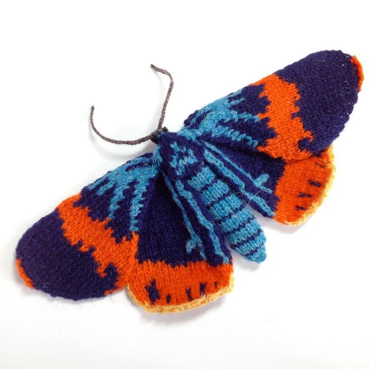 an orange and blue knitted butterfly ornament