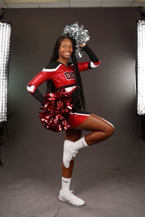 a woman in a cheerleader outfit posing for a photo