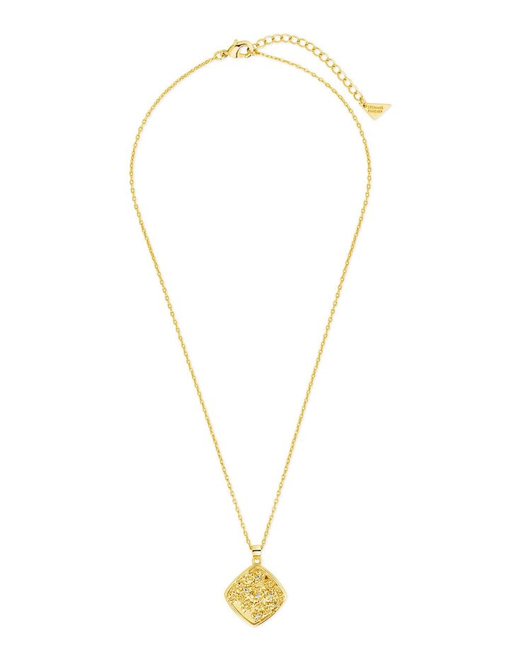 Indulge in the intricate floral embossing and sparkling CZ stones of the Ophelia Pendant Necklace. This elegant necklace is a luxurious addition to any ensemble, adding understated glamour and sophistication. Elevate your style with this exclusive piece that exudes artful beauty. Material: 14K gold or rhodium plated brass, cubic zirconia Features: Measures 16" with 2" extender, 1" pendant, 1mm CZ stones, 1.25mm chain, Lead & Nickel free, lobster clasp Elegant Locket Necklace With Coin Pendant, Elegant Medallion Chain Necklace As Gift, Opulent Gold Necklace For Gift, Elegant Medallion Chain Necklace For Gift, Elegant Pendant Medallion Necklace For Formal Occasions, Elegant Engraved Pendant Chain Necklace, Elegant Jewelry With Delicate Chain And Medallion, Formal Flower Pendant Necklace With Intricate Design, Elegant Pendant Chain Necklace