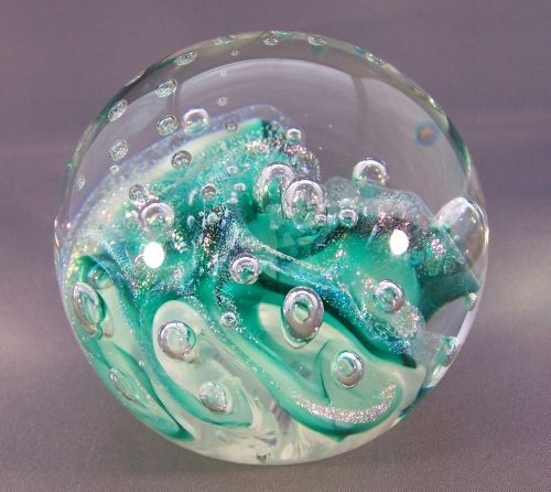 a glass bowl filled with water and bubbles