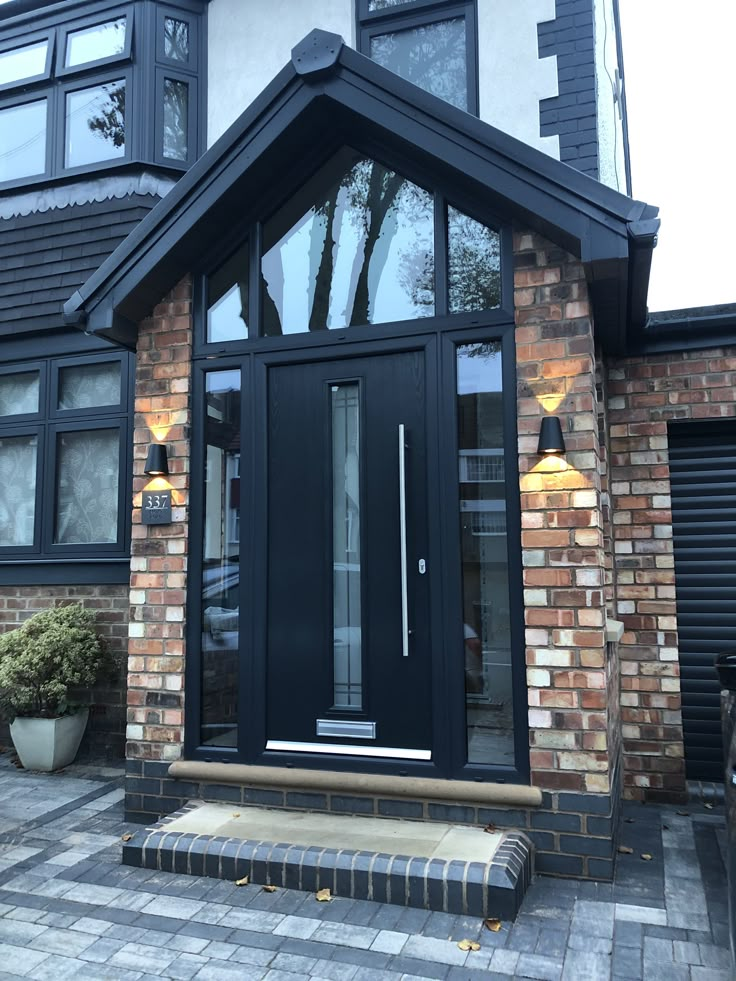 a black front door on a brick house