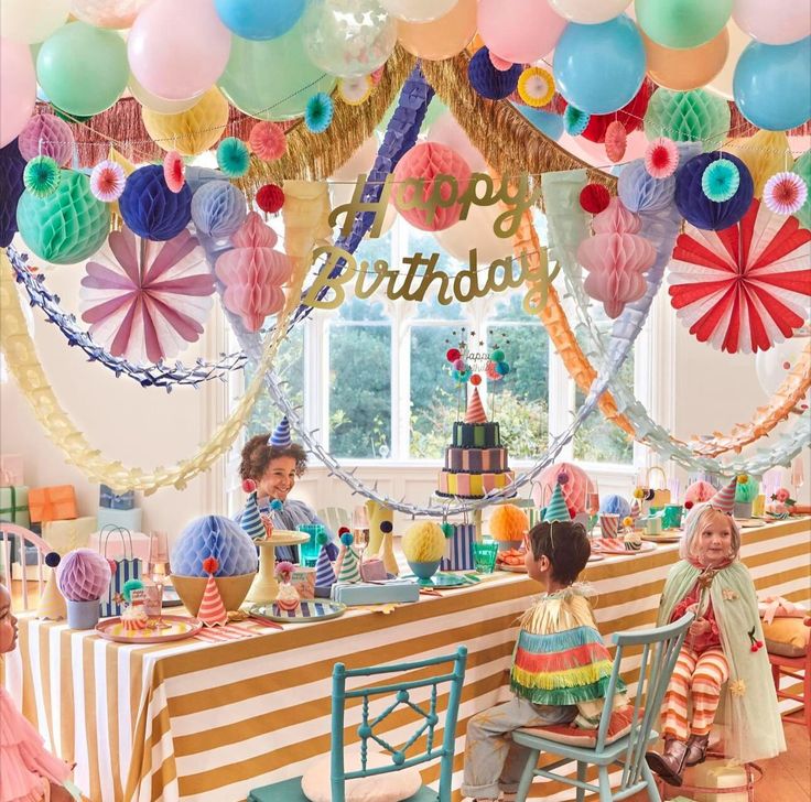 a birthday party with balloons and decorations