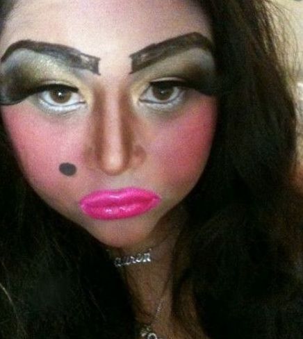 a woman with makeup on her face and eyebrows