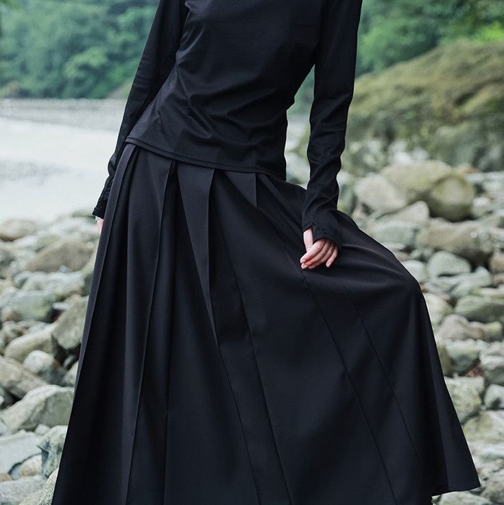 A drape pleated skirt dyed in jet black.
 The sturdy fabric has a heavy feel and a high-class atmosphere.
 It looks sharp and cold, but the pleats that sway when you walk make it an item that will not forget your femininity.




 <Size>



 small size






 Total length: 86cm

 Waist: 66cm




 medium size



 Total length: 87.5cm

 Waist: 70cm











 <Material>



 polyester

 Nylon








 <model wearing>



 wearing size



 medium size




 model dimensions



 Height: 168cm

 Weig Black Long Skirt With Folds, Black Relaxed Skirt With Folds, Relaxed Black Skirt With Folds, Black Relaxed Fit Skirt With Folds, Black Long Pleated Skirt With Accordion Pleats, Black Flowy Accordion Pleats Maxi Skirt, Black Gathered Maxi Skirt For Fall, Solid Fall Pleated Skirt With Accordion Pleats, Fall Solid Color Accordion Pleated Skirt