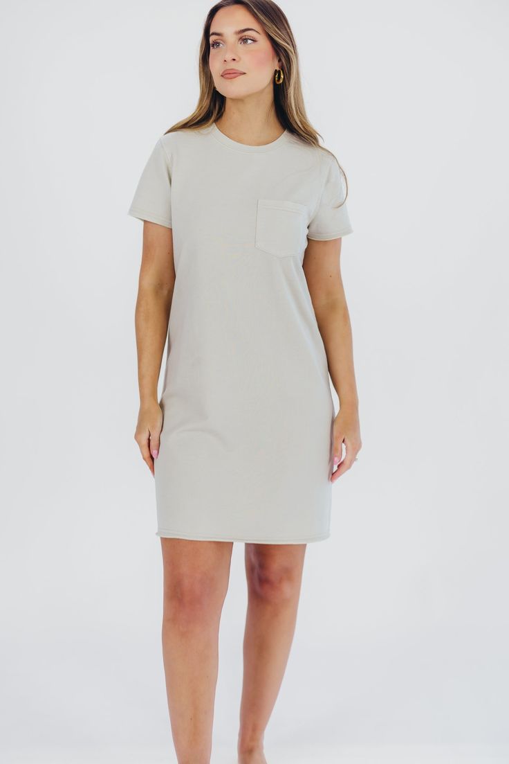 The ultimate travel dress just hit our shelves - meet the Raiya T-Shirt Dress, your new go-to! This cotton-blend mini dress is relaxed and comfortable without sacrificing style; dress it up with mules or wedges, or dress it down with sneakers for versatile, multi-season wear! FIT: Runs true to size. MATERIAL: 60% Cotton, 40% Polyester. Hand wash cold. GARMENT DETAILS: Relaxed fit t-shirt dress in a mini length, with high crewneck, short sleeves, and single chest pocket. SIZE GUIDE: XS (0-2) / S (2-4) / M (6-8) / L (10-12) MODEL DETAILS: Mackenzie - Size S Heather - Size S Molly - Size XL Our Brunette Misses Model Our Blonde Misses Model Our Blonde Curve Model Bust 34" 34" 37" Waist 27.5" 27.5" 32" Hips 40.5" 37.5" 47" Height 5'7" 5'7" 5'7" Casual Everyday Mini Dress, Casual Solid Dresses For Everyday, Casual Solid Everyday Dress, Spring Everyday Mini Dress, Everyday Spring Mini Dress, Cotton Mini Dress For Everyday, Cotton Mini Dress For Everyday Wear, Everyday Cotton Mini Dress, Casual Loungewear Dress With Curved Hem