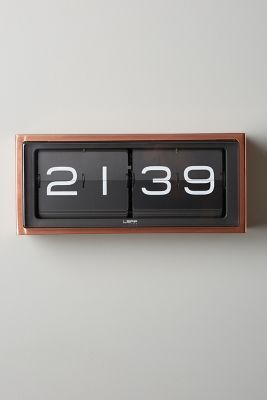 an analog clock with the time twenty nine