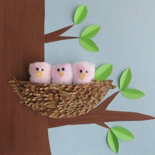 three little pink birds sitting in a nest on a tree branch with green leaves painted on the wall behind them