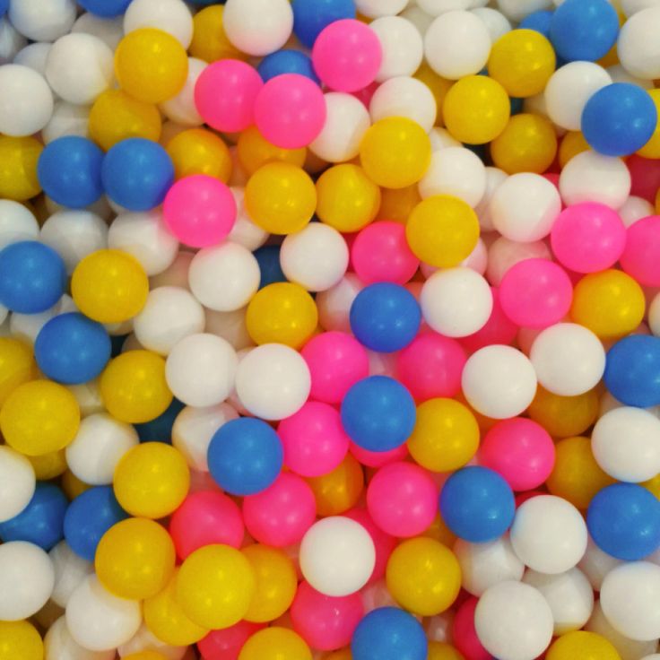 many different colored balls are scattered together