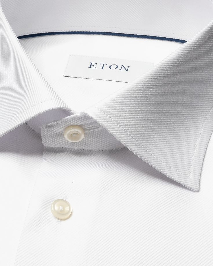 An exquisite classic dress shirt crafted from our textured twill fabric that is distinguished by its structured texture. This modern style statement features a robust and prominent texture while remaining silky soft, setting it apart as a remarkable alternative to traditional dress shirts. Crafted to perfection, it is exceptional for both business and elegant evening attire. Elegant Tailored Cotton Tops, Elegant Slim Fit Tops With Hidden Button Closure, Elegant Semi-formal Shirt With Button Closure, Tailored Elegant Formal Shirt, Elegant Cotton Dress Shirt With Hidden Button Closure, Elegant Business Tops With Button Closure, Formal Tailored Elegant Shirt, Elegant Tailored Formal Shirt, Elegant Business Top With Button Closure