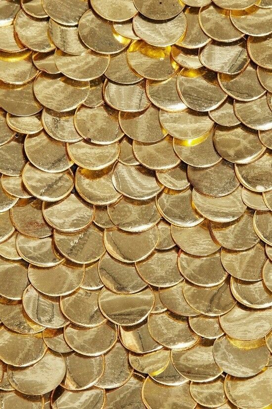 gold coins are stacked on top of each other to make a background or wallpaper