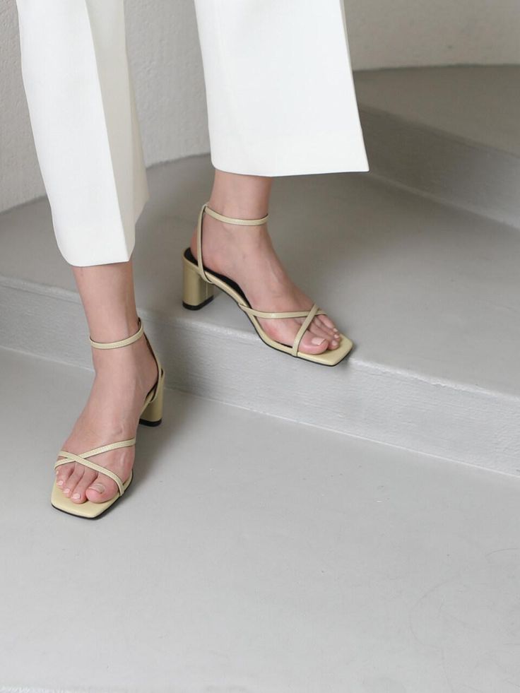 Editor's NotesSimple strappy sandals from APTO go with everything in the summer- Simple strap sandals- X shape crossed strap- Square toe- Sculptural heels- Adjustable ankle strapMeasuremets(in.)- Size: KR230(US6) - KR250(US8)- Heel height: 2.4in.- Fits true to the sizeComposition & Care- Synthetic leather- Do not wash- Avoid moisture- Partial clean with a leather cleanerDesigner- Made in Korea- by APTO Spring Cross Strap Heels With Straps, Summer Party Sandals With Cross Strap, Summer Heels With Cross Straps, Spring Slingback Sandals With Single Toe Strap, Summer Strappy Sandals With Heel Strap, Strappy Sandals With Heel Strap For Spring, Strappy Sandals With Heel Strap For Summer, Summer Cross Strap Heels With Wrapped Heel, Strappy Sandals With Wrapped Heel, Medium Width