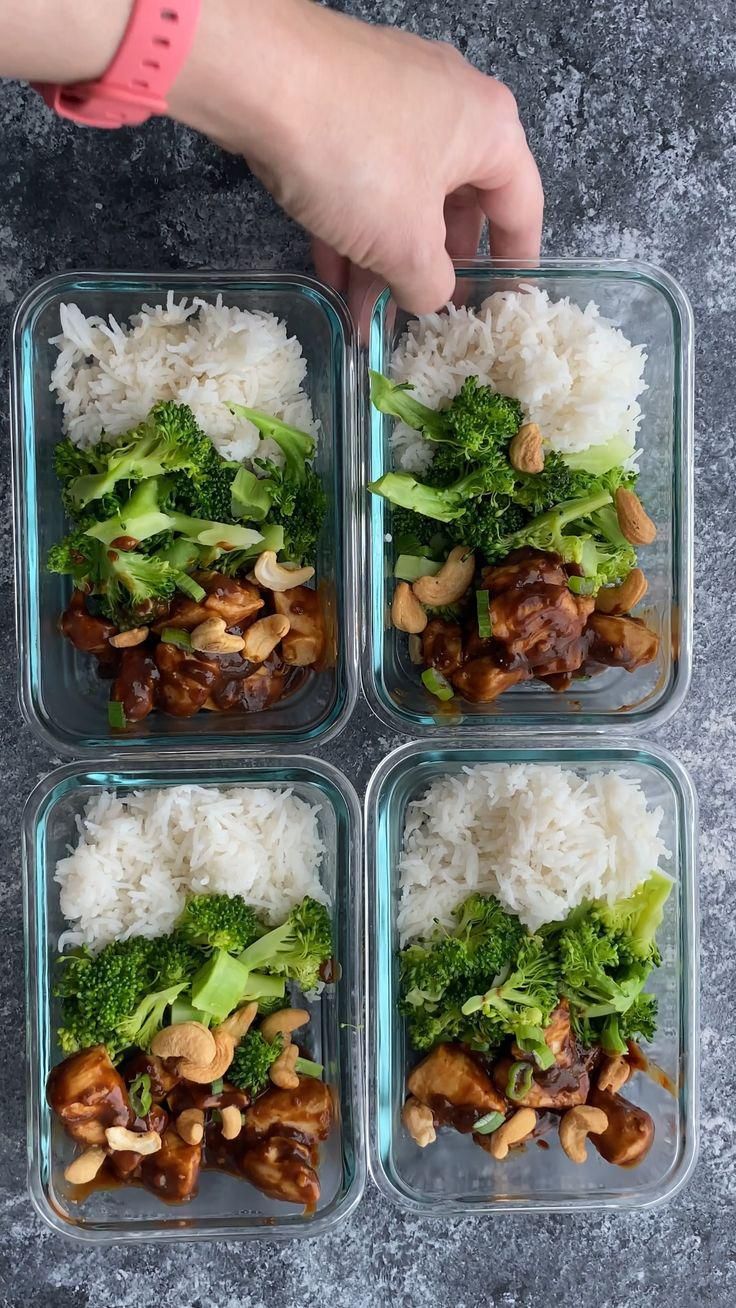 four plastic containers filled with rice and broccoli