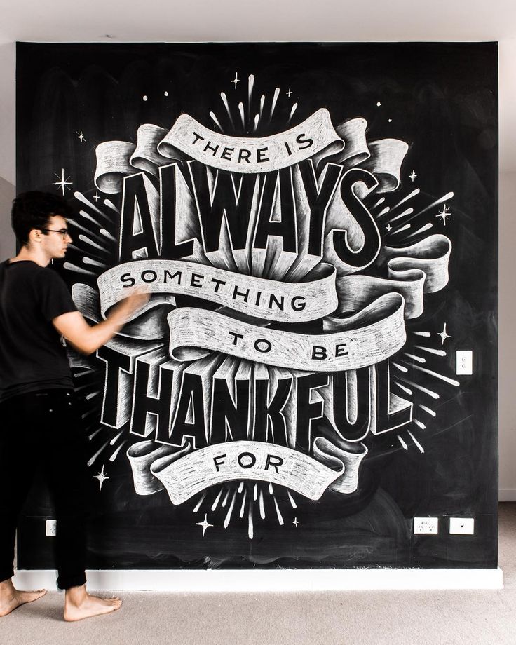 a man standing in front of a chalkboard with the words, there is always something to be grateful for