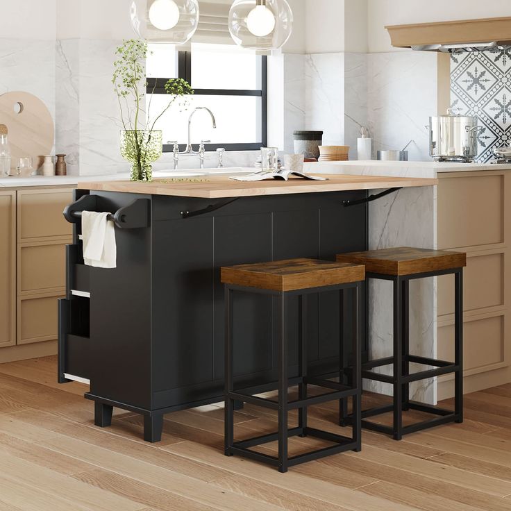 a kitchen island with two stools next to it