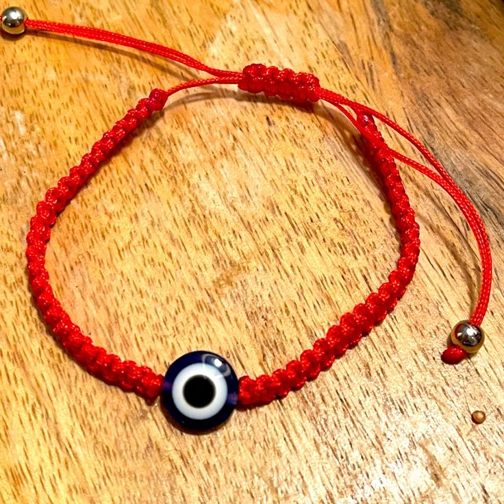 Red Bracelet Casual Red Braided Bracelets As Gift, Casual Red Braided Bracelets For Gift, Handmade Red Casual Friendship Bracelets, Casual Red Handmade Friendship Bracelets, Casual Red Jewelry With Sliding Knot, Casual Red Friendship Jewelry, Casual Red Jewelry For Friendship, Red Bohemian Jewelry With Sliding Knot, Trendy Red Adjustable Braided Bracelets