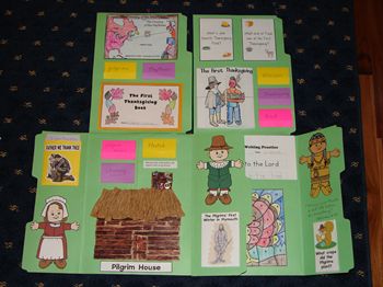 several children's books are arranged on top of a quilted tablecloth with pictures and words