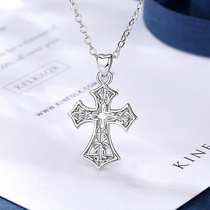 Feel blessed and stay classy by wearing this religious cross designed neck jewelry. Innovato Designs introduces another top-of-the-line religious accessory that is amazingly detailed and intricate.  Wearing the luxury fashion Celtic cross necklace is a testament of your faith and shows your angelic beauty that brightens the room.  The necklace pendant is made of pure 925 sterling silver and polished into perfection. The 18k Rhodium plates make the jewelry shine brightly just like real platinum. It is highly resistant to oxidation, color-change, as it is also very safe and fashionable.  Specifications:   Trendy Celtics pendant necklace for women  Link chain necklace  The cross-patterned pendant at 28 x 17mm big  Made of 100% 925 Sterling silver  Gift for girlfriend, fiancée, wife, lover White Gold Cross Necklace With Clavicle Chain, Elegant Sterling Silver Crucifix Charms, Elegant Sterling Silver Crucifix Jewelry, Elegant Sterling Silver Crucifix Jewelry And Charms, Intricate Crucifix Necklace As A Gift, Intricate Crucifix Necklace For Gift, Crucifix Necklace With Intricate Design For Gifts, Elegant Sterling Silver Cross Charms And Jewelry, Elegant Sterling Silver Cross Jewelry And Charms