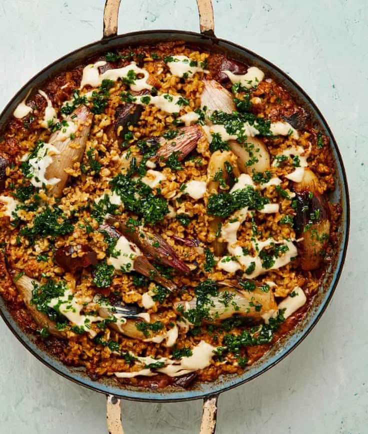 a pan filled with food sitting on top of a table